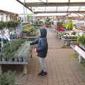 2020 Harry points at tiny trees in the garden centre