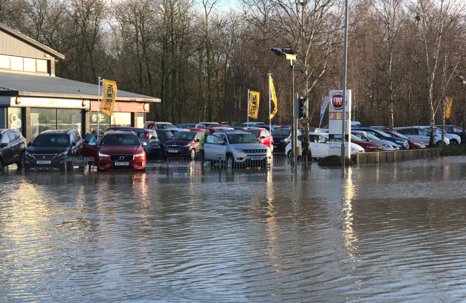 The garage staff rescue some cars, from The Christmas Eve Floods, Diss, Norfolk - 24th December 2020