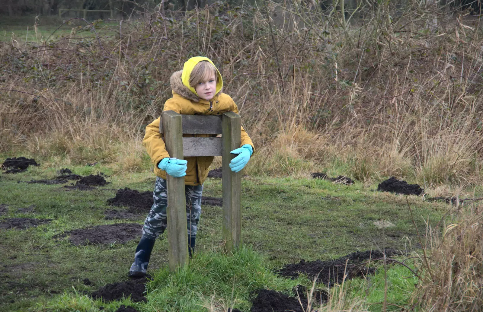 Harry leans on a sign, from A Walk Around Redgrave and Lopham Fen, Redgrave, Suffolk - 3rd January 2021