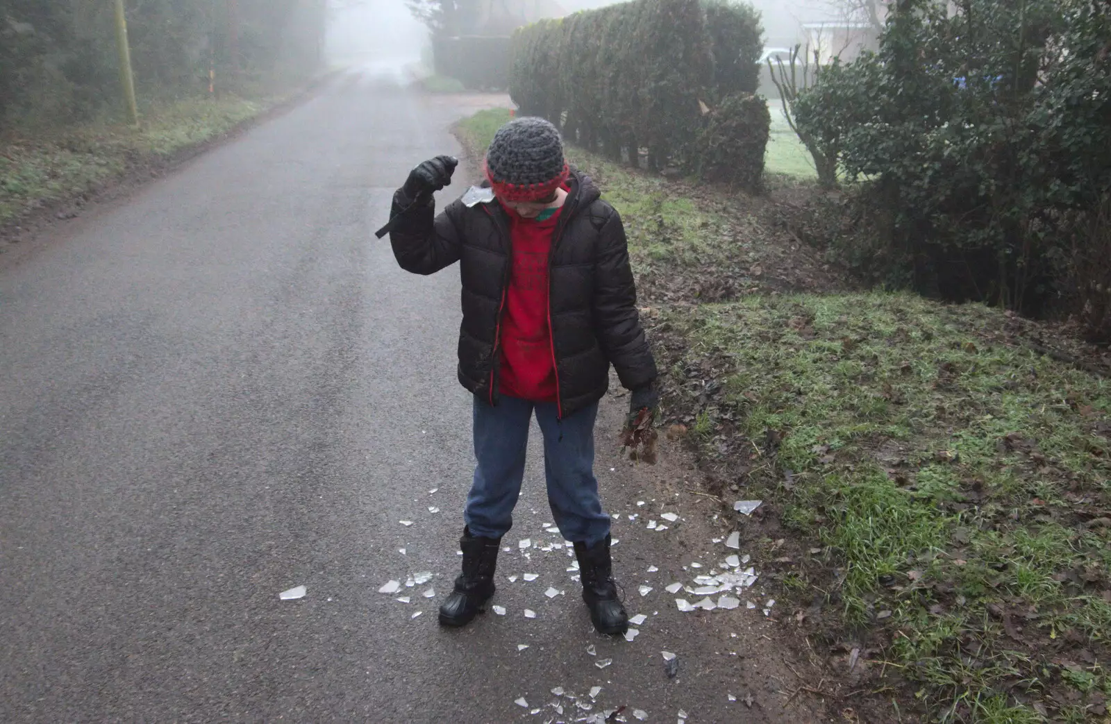 Fred smashes the ice sheet on his head, from Fun With Ice in Lockdown, Brome, Suffolk - 10th January 2021