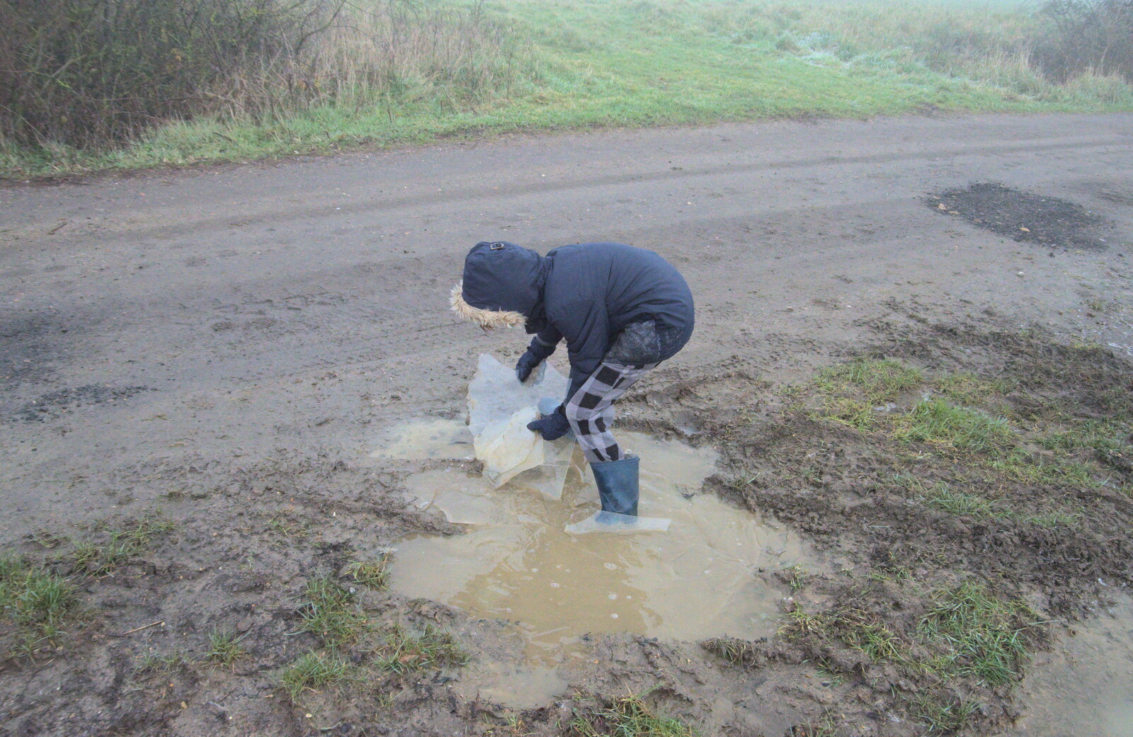Harry scoops ice out of a puddle from Fun With Ice in Lockdown, Brome, Suffolk - 10th January 2021