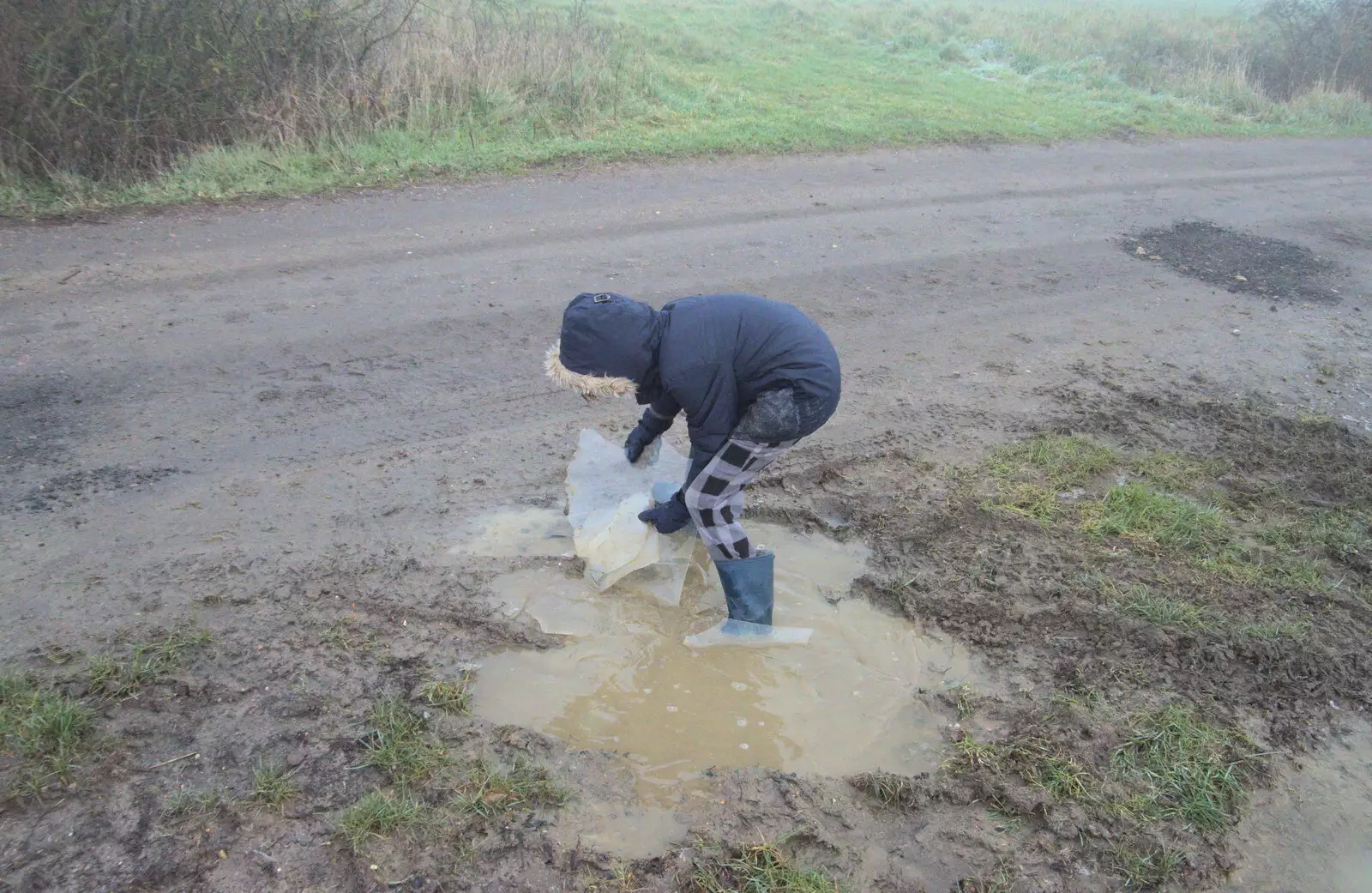 Harry scoops ice out of a puddle, from Fun With Ice in Lockdown, Brome, Suffolk - 10th January 2021