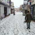 Some dude stomps past WHSmith, A Snowy Morning, Diss, Norfolk - 16th January 2021