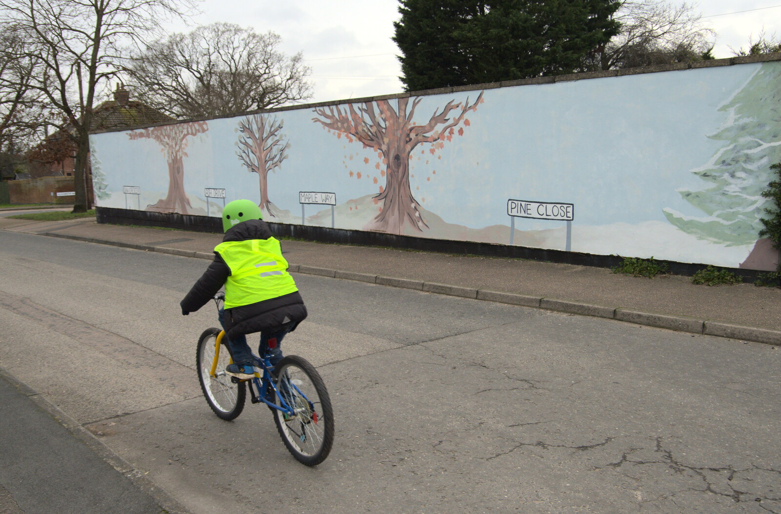 Fred cycles past the Tree mural from A Trip to the Blue Shop, Church Street, Eye, Suffolk - 2nd February 2021
