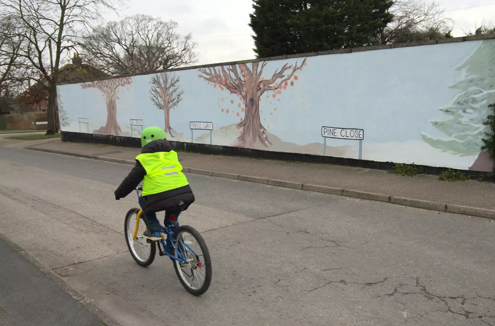 Fred cycles past the Tree mural, from A Trip to the Blue Shop, Church Street, Eye, Suffolk - 2nd February 2021