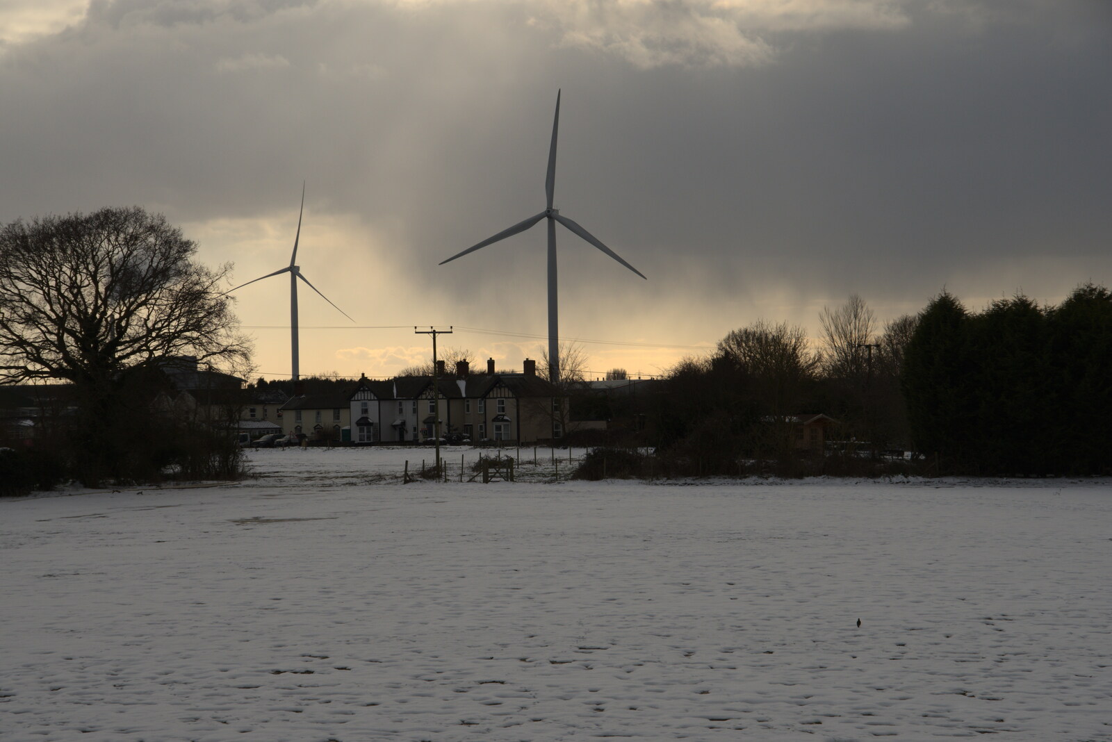 Snow looms behind the wind turbines from Derelict Infants School and Ice Sculptures, Diss and Palgrave, Norfolk and Suffolk - 13th February 2021
