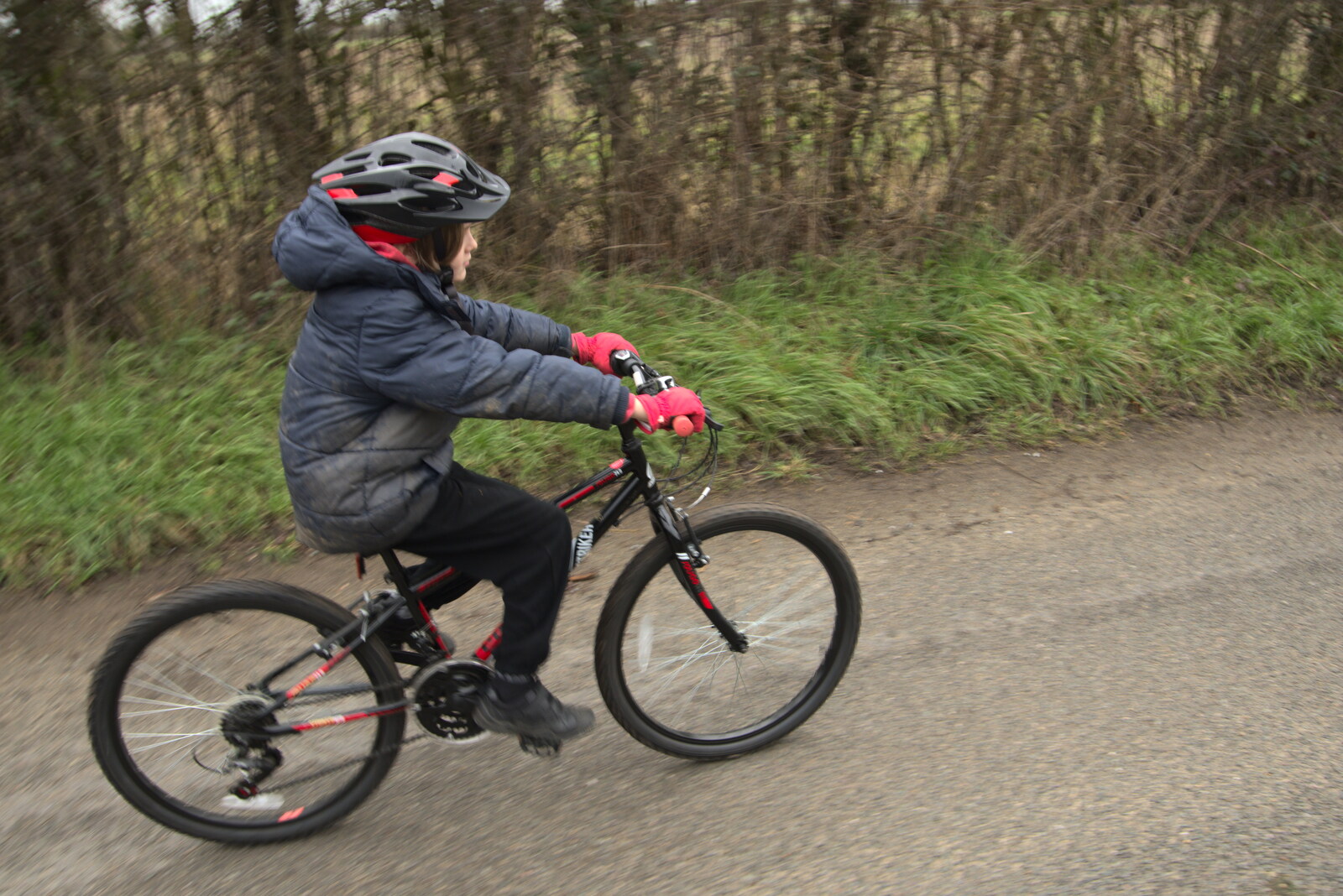 Harry cycles up the road from The Old Sewage Works, The Avenue, Brome, Suffolk - 20th February 2021