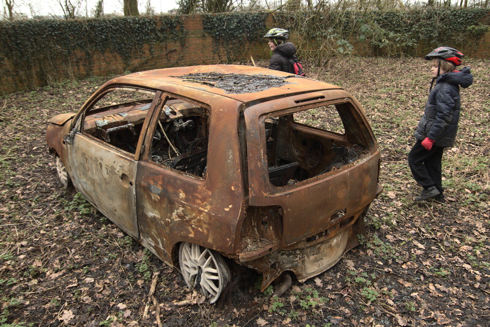 The boys inspect a burned-out car from The Old Sewage Works, The Avenue, Brome, Suffolk - 20th February 2021