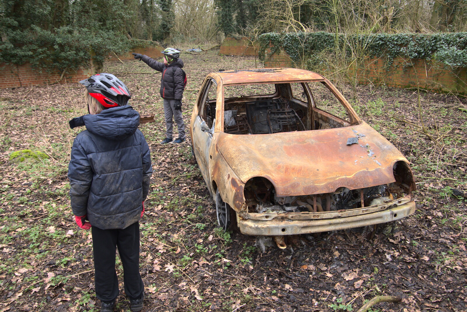 Fred points away from the burned car from The Old Sewage Works, The Avenue, Brome, Suffolk - 20th February 2021