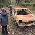 Fred points away from the burned car, The Old Sewage Works, The Avenue, Brome, Suffolk - 20th February 2021