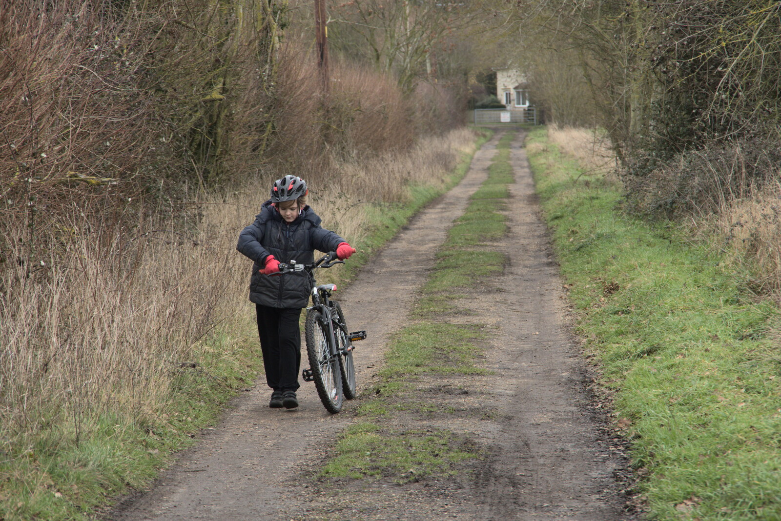 Harry pushes his bike up the hill from The Old Sewage Works, The Avenue, Brome, Suffolk - 20th February 2021