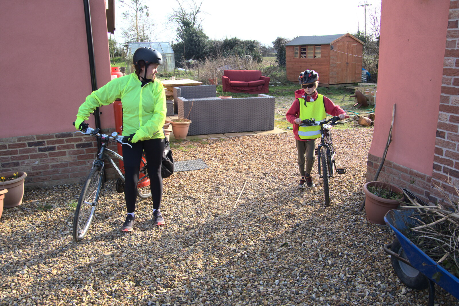 Isobel and Harry wheel their bikes out from Fred's New Bike and an A140 Closure, Brome, Suffolk - 27th February 2021