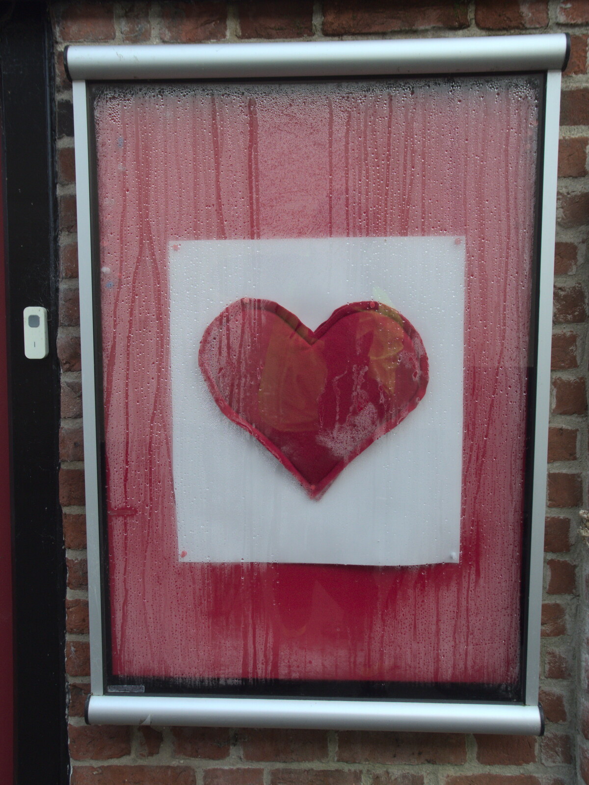 A red felt heart in a frame from The Mean Streets of Eye, Suffolk - 7th March 2021