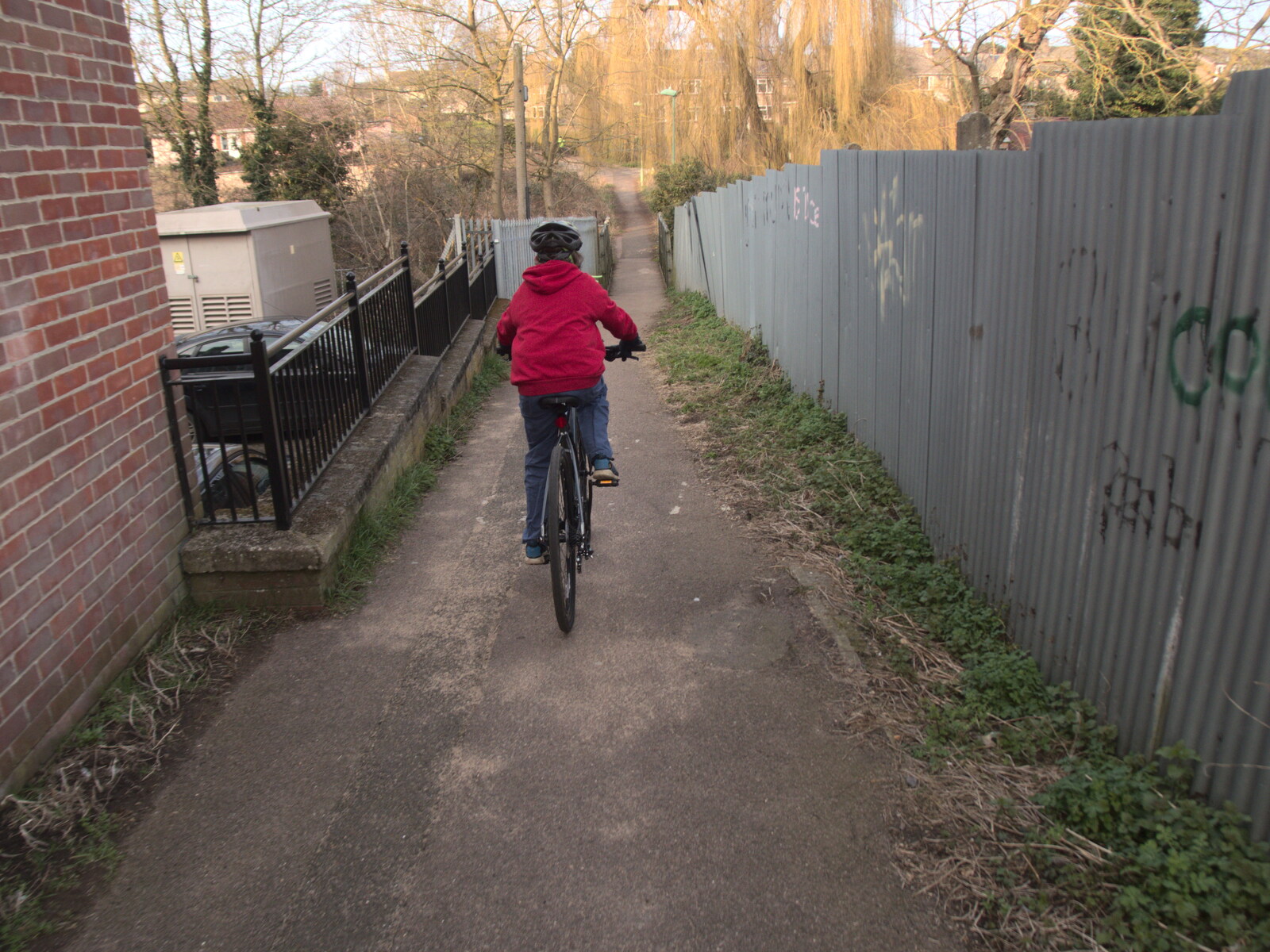 Fred bikes down to the bridge from The Mean Streets of Eye, Suffolk - 7th March 2021