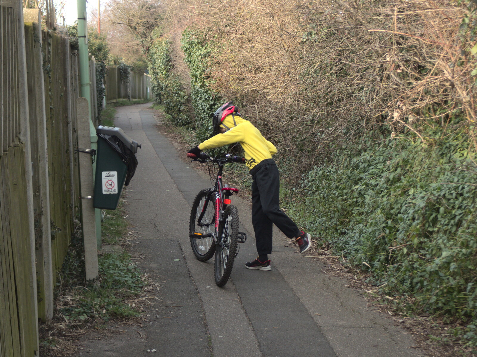 Harry gets back on his bike after a push up the hill from The Mean Streets of Eye, Suffolk - 7th March 2021