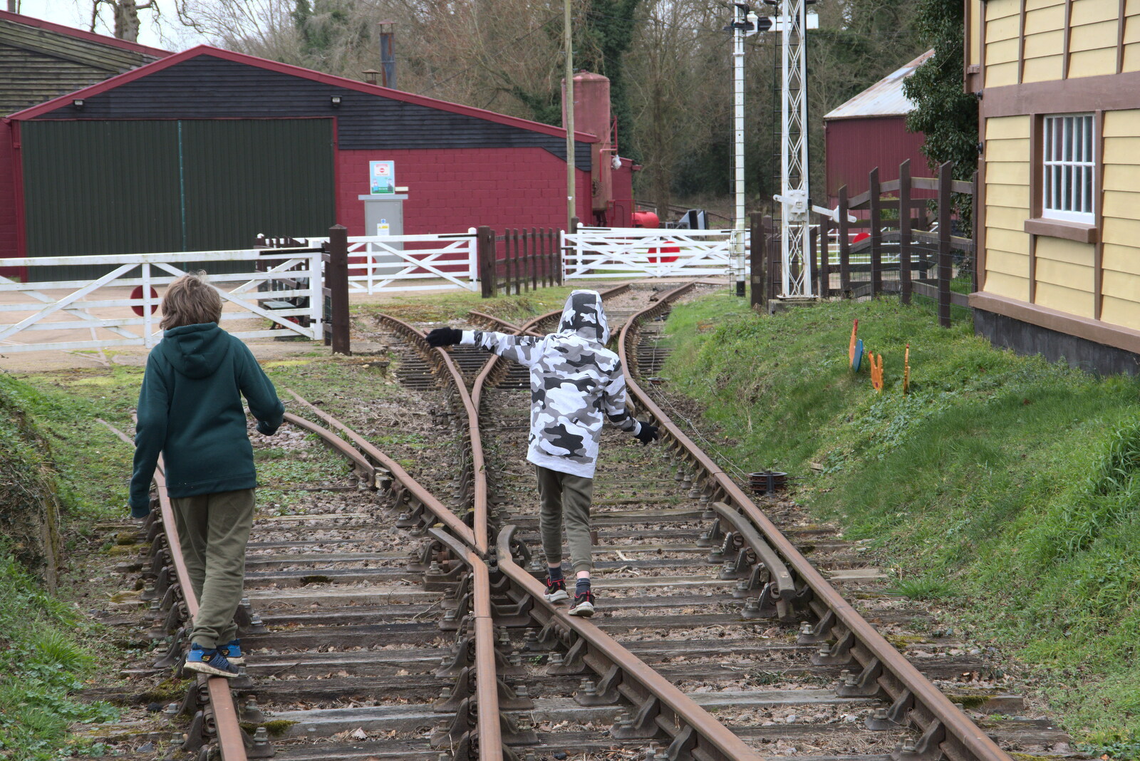 Fred and Harry walk on the rails from A Return to Bressingham Steam and Gardens, Bressingham, Norfolk - 28th March 2021