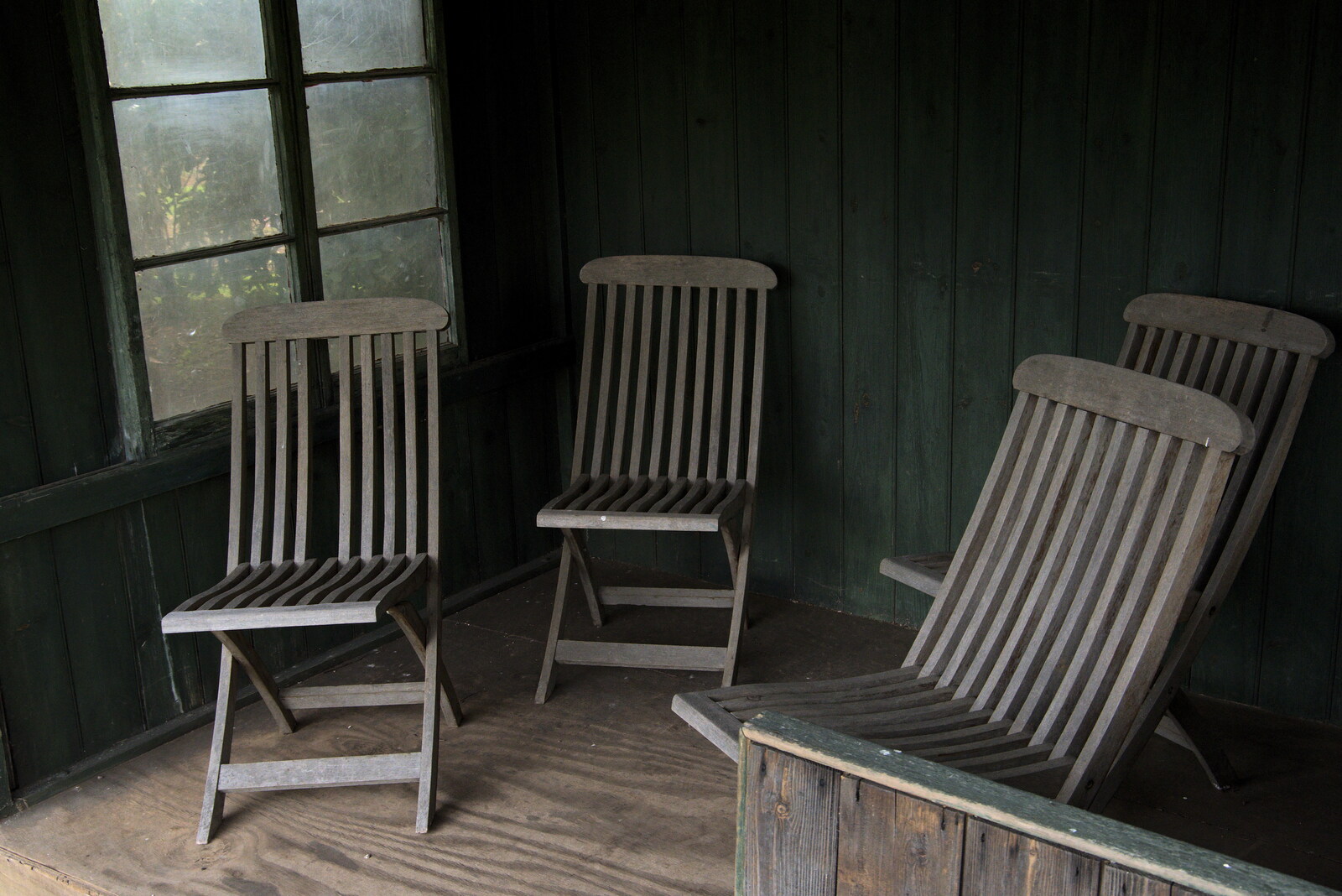 Four teak chairs in a garden house from A Return to Bressingham Steam and Gardens, Bressingham, Norfolk - 28th March 2021