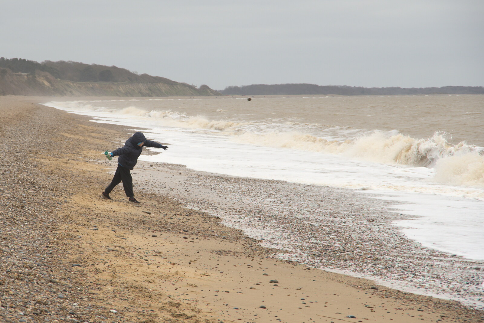 Harry throws a rock into the sea from A Trip to Dunwich Beach, Dunwich, Suffolk - 2nd April 2021
