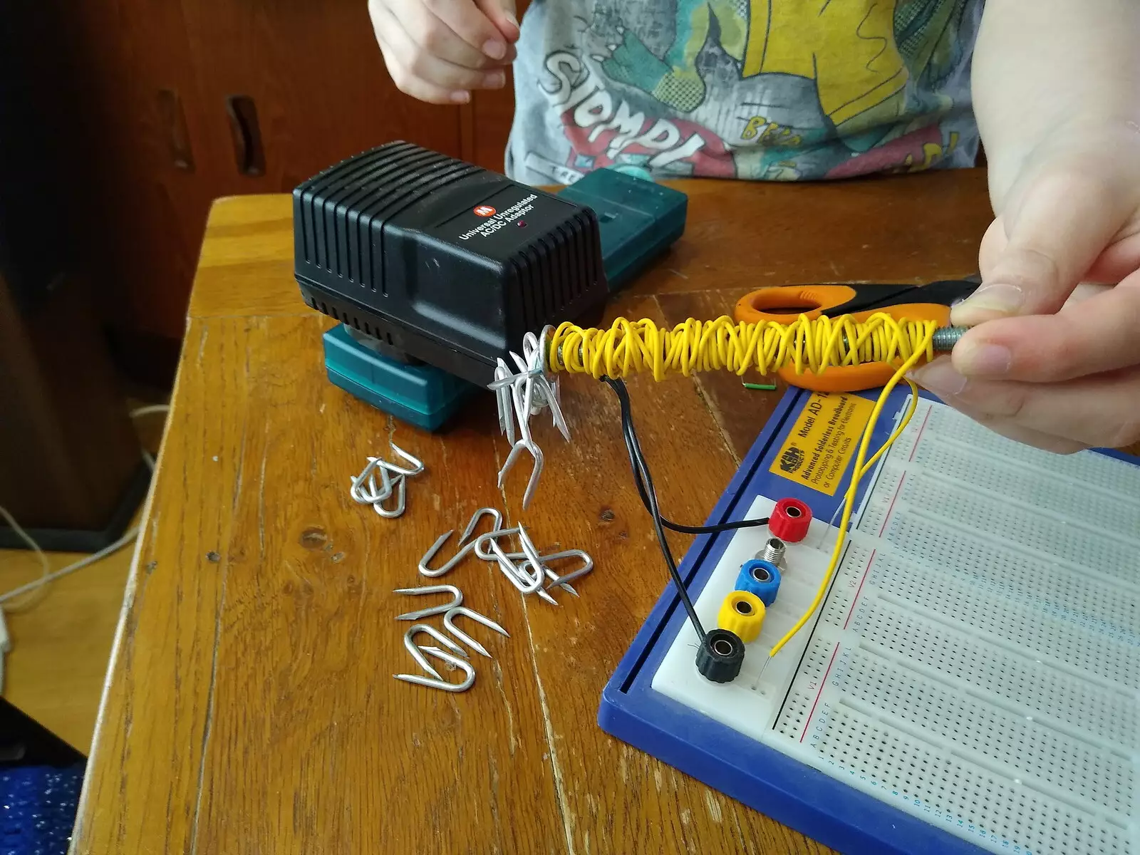 Fred picks nails up with an electromagnet, from A Cameraphone Roundup, Brome and Eye, Suffolk - 12th April 2021