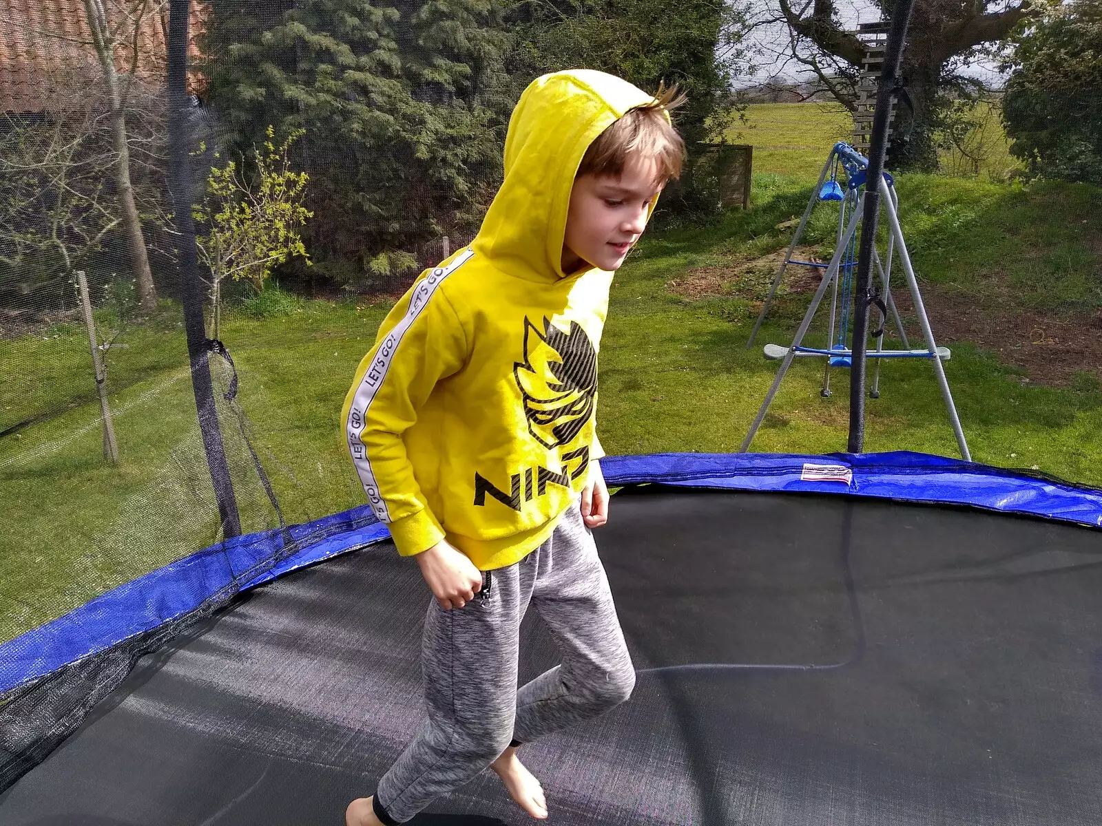 Harry runs around on the trampoline, from A Cameraphone Roundup, Brome and Eye, Suffolk - 12th April 2021