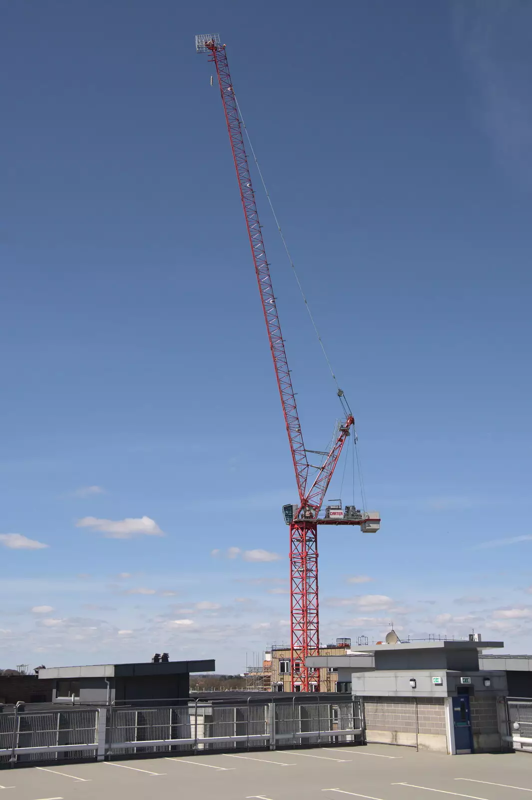 A tall crane looms over the car park, from The Death of Debenhams, Rampant Horse Street, Norwich, Norfolk - 17th April 2021