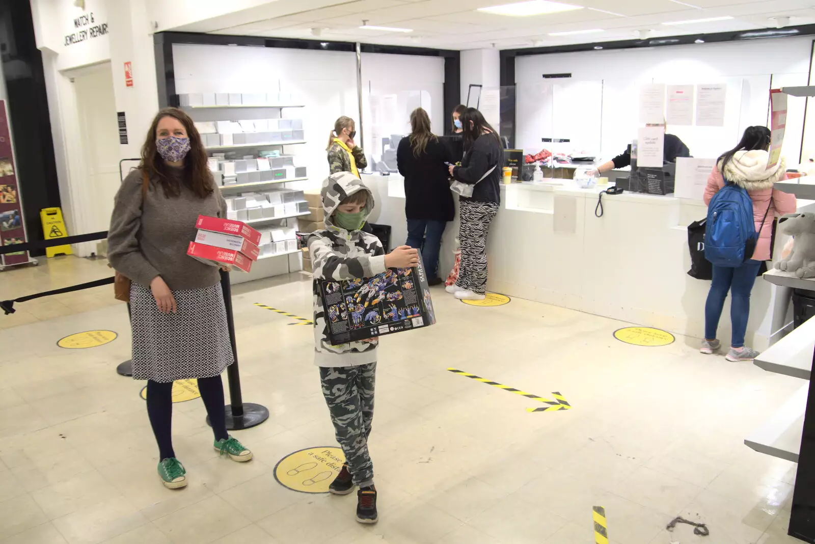 Isobel and Harry queue up to pay for stuff, from The Death of Debenhams, Rampant Horse Street, Norwich, Norfolk - 17th April 2021