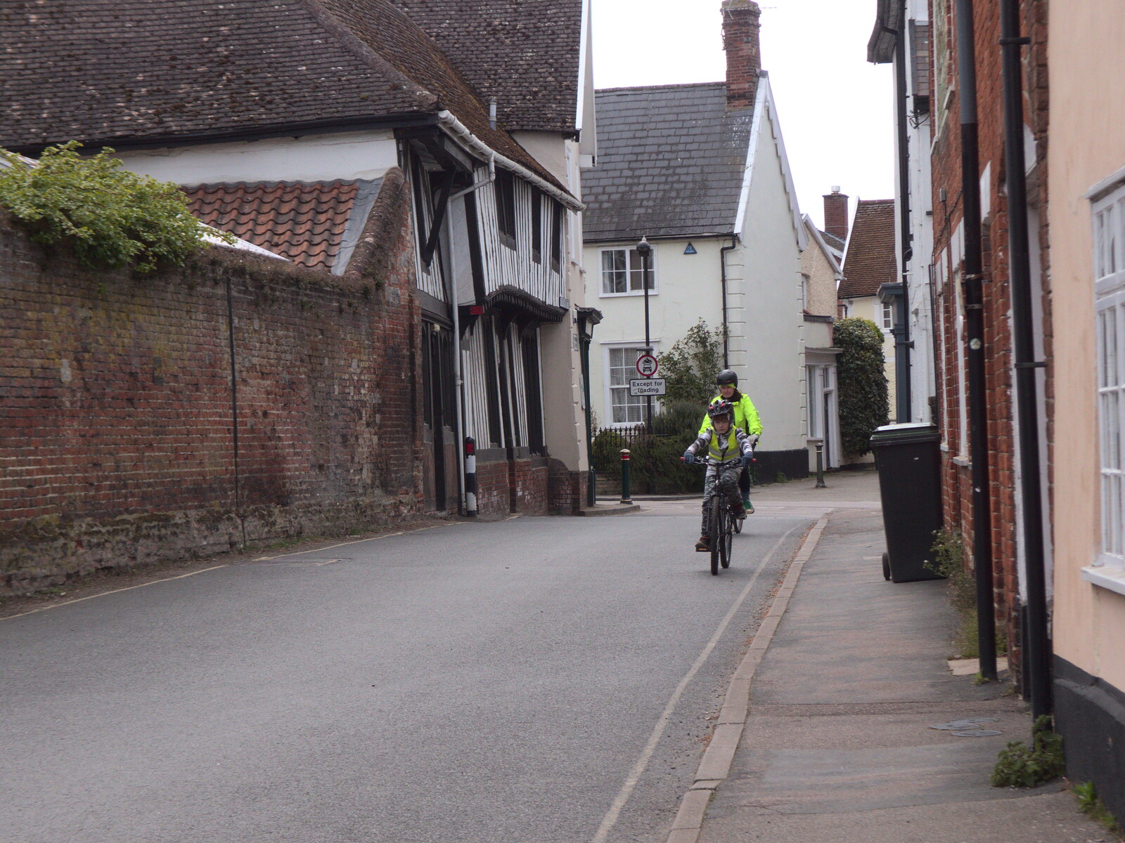Harry and Isobel cycle up Church Street from BSCC Beer Garden Hypothermia, Hoxne and Brome, Suffolk - 22nd April 2021