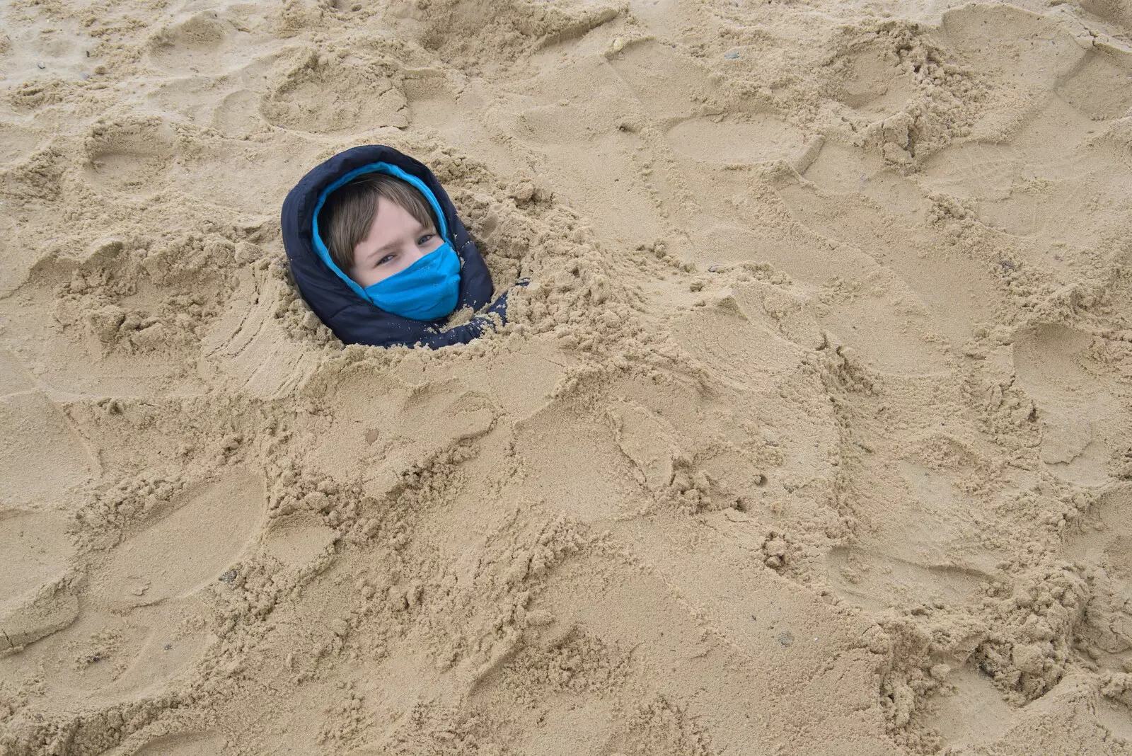 Nosher buries Harry, from A Chilly Trip to the Beach, Southwold Harbour, Suffolk - 2nd May 2021