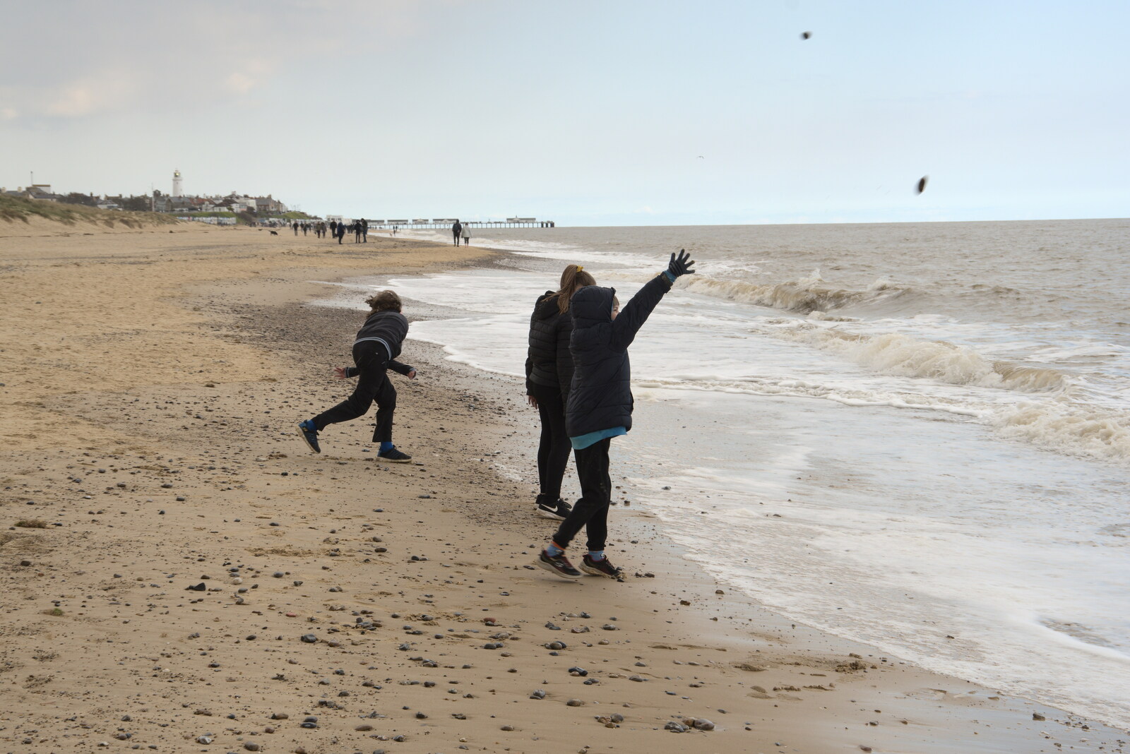Fred and Harry hurl stones at the sea from A Chilly Trip to the Beach, Southwold Harbour, Suffolk - 2nd May 2021