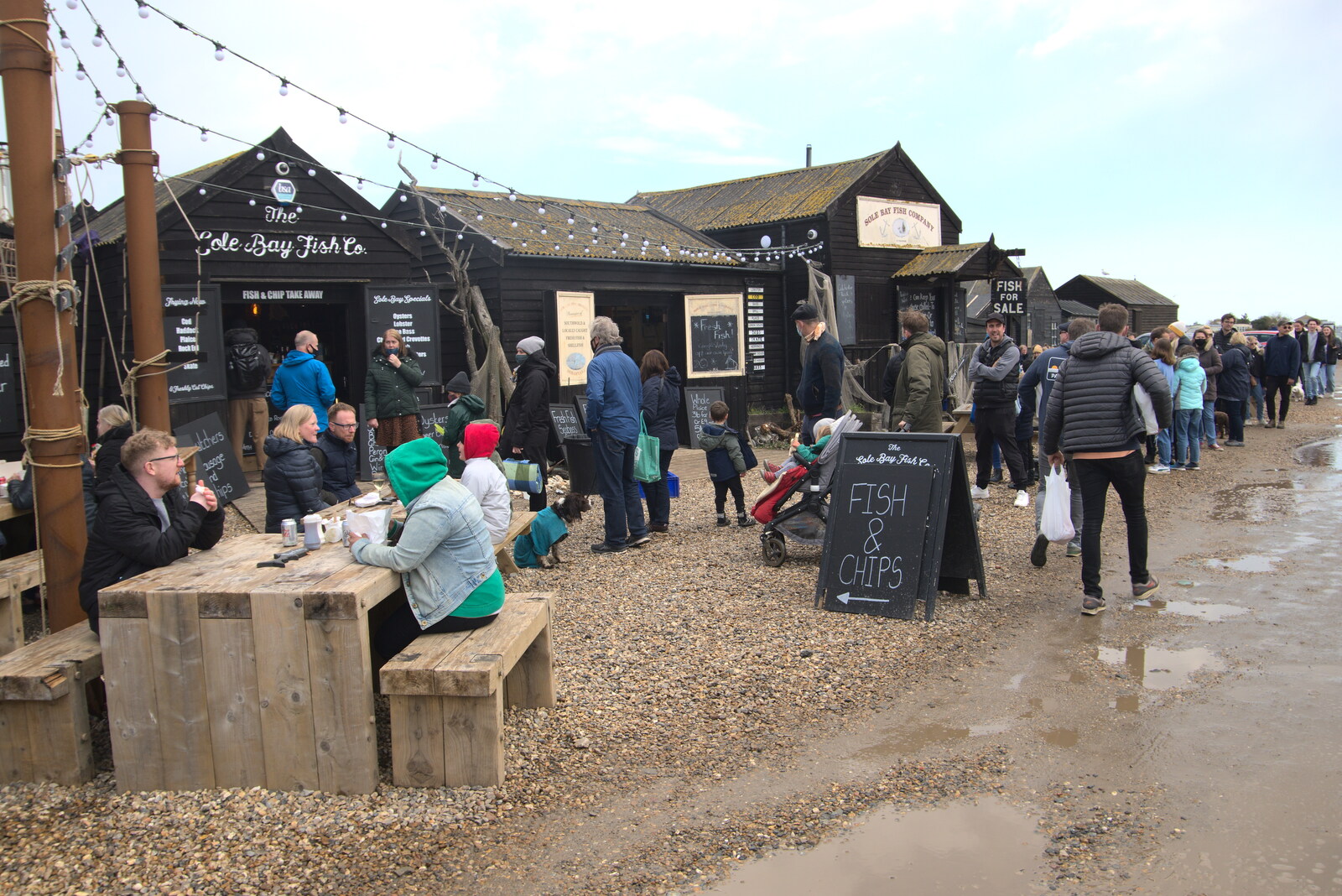 People mill around by the Sole Bay Fish Co. from A Chilly Trip to the Beach, Southwold Harbour, Suffolk - 2nd May 2021