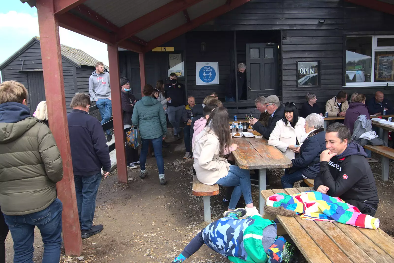 Isobel gets in the queue at Mrs T's, from A Chilly Trip to the Beach, Southwold Harbour, Suffolk - 2nd May 2021