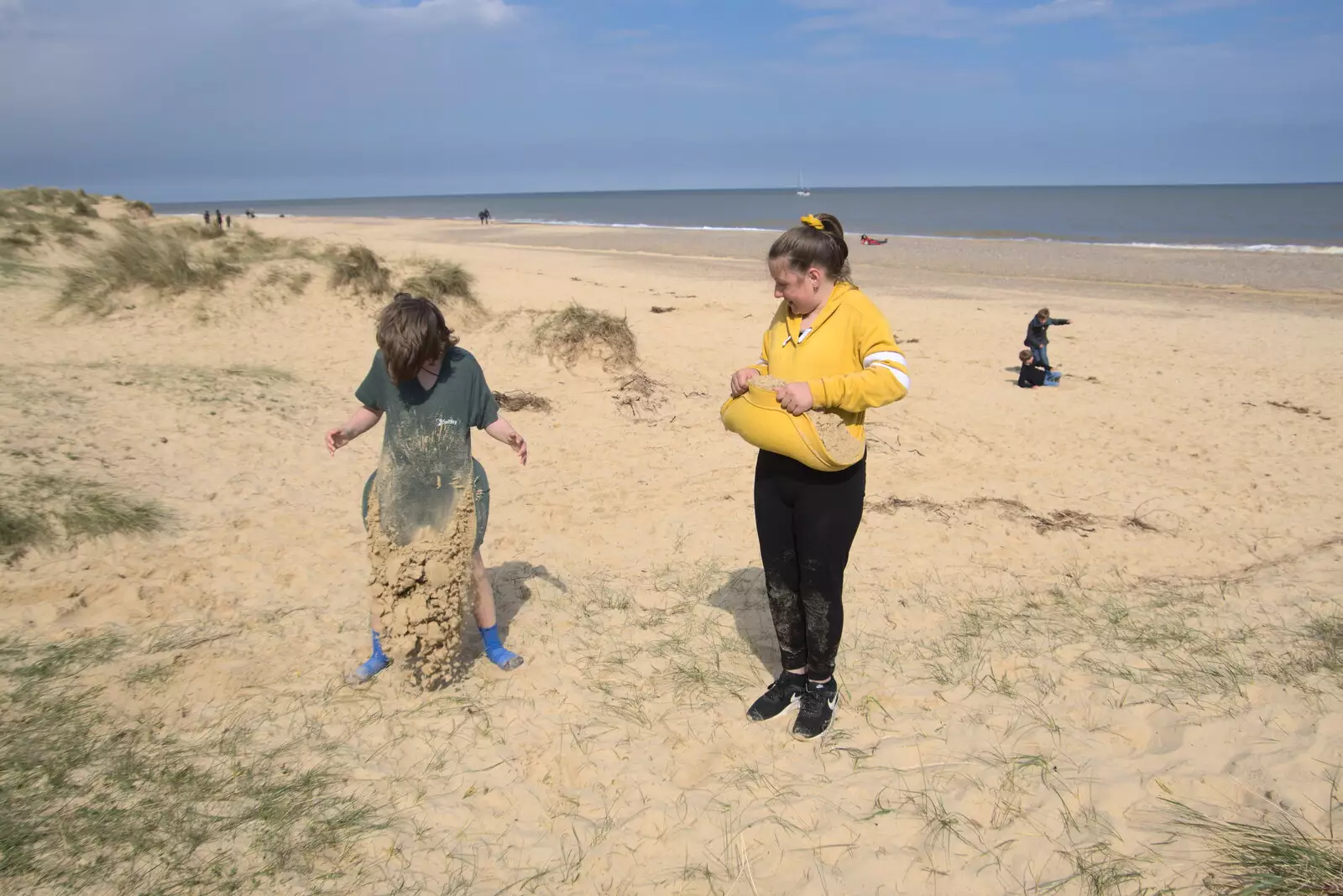 Fred dumps a pile of sand out of his teeshirt, from A Chilly Trip to the Beach, Southwold Harbour, Suffolk - 2nd May 2021