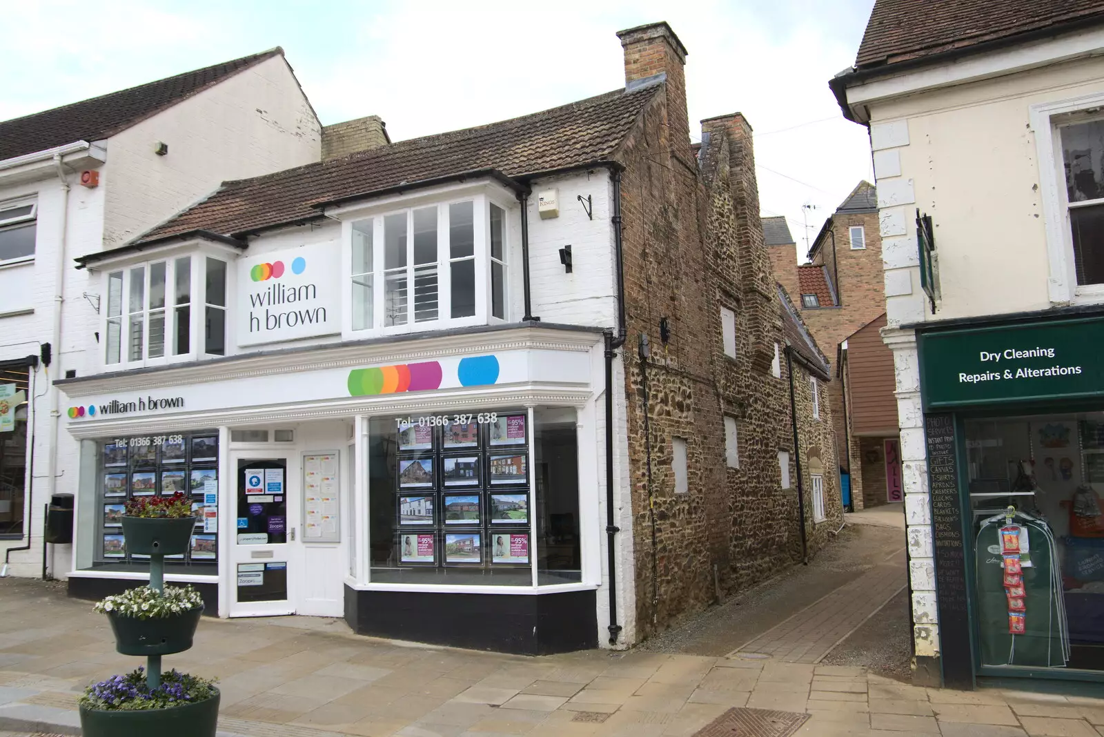 There's a very old building behind W.H. Brown's, from A Vaccination Afternoon, Swaffham, Norfolk - 9th May 2021