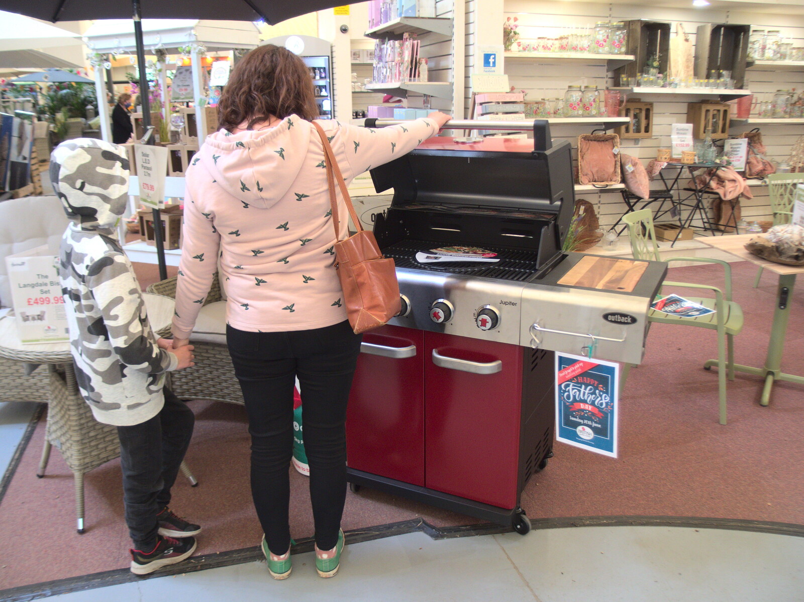 Isobel checks a barbeque out at Bressingham from Garden Centres, and Hamish Visits, Brome, Suffolk - 28th May 2021