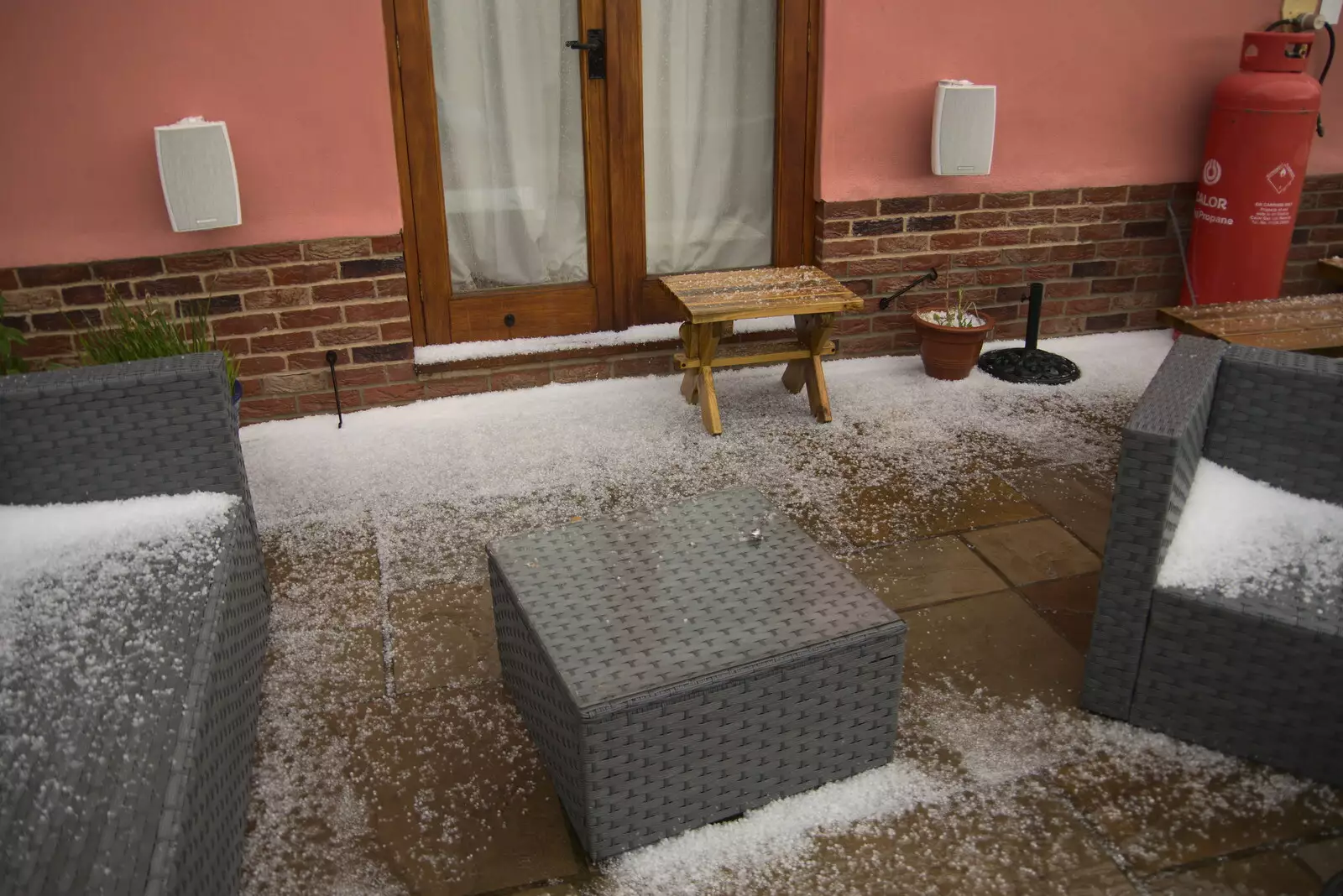 The hail drifts up on the garden furniture, from A Day at the Beach with Sis, Southwold, Suffolk - 31st May 2021