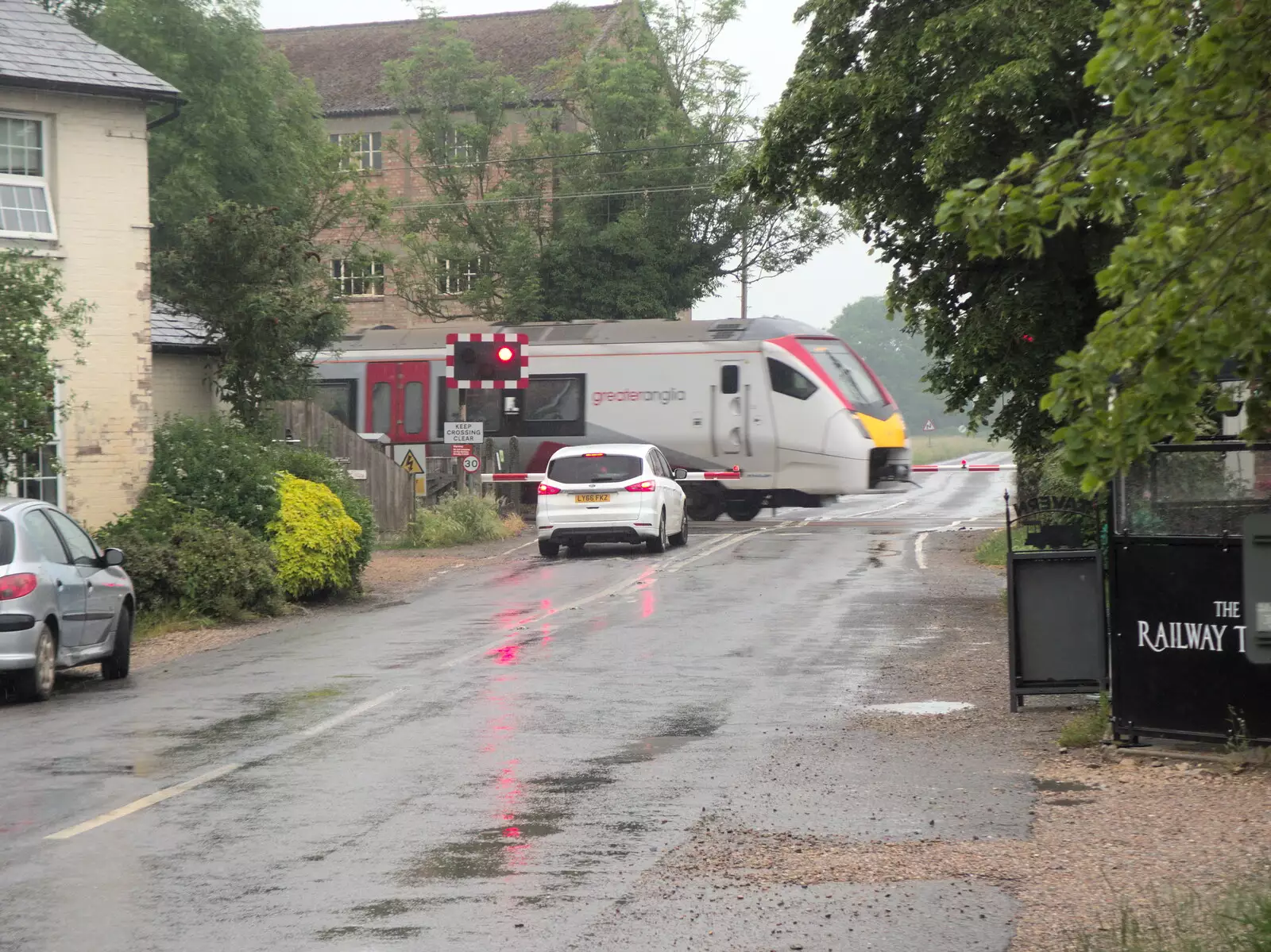 Greater Anglia's Stadler FLiRT at the crossing, from A BSCC Ride to Pulham Market, Norfolk - 17th June 2021