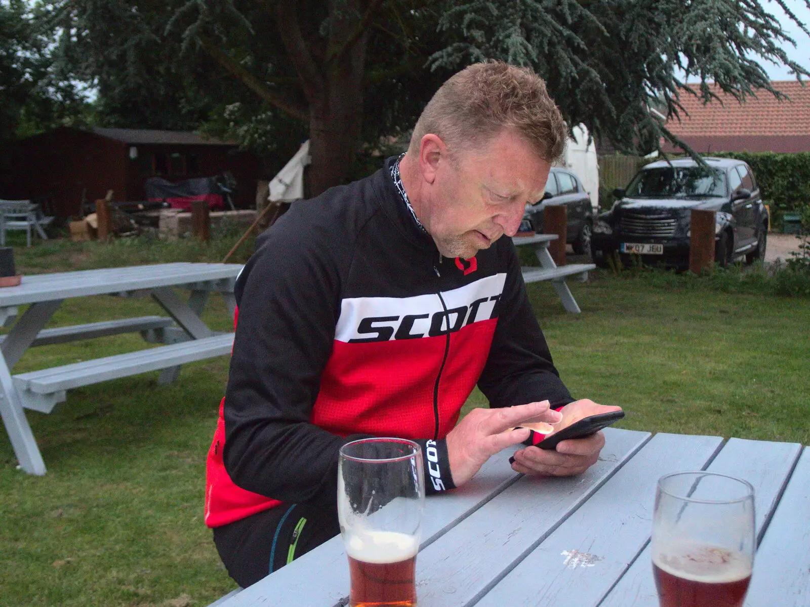 Gaz checks something on his phone, from A BSCC Ride to Pulham Market, Norfolk - 17th June 2021