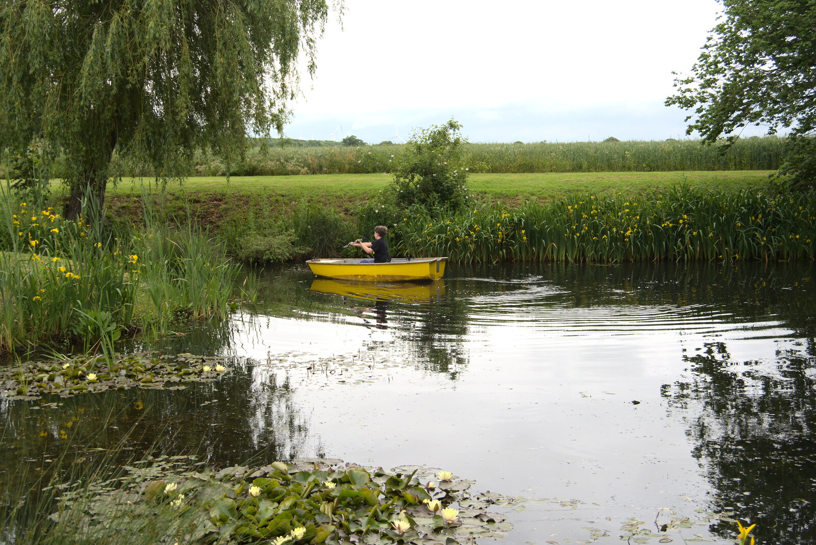 Fred floats off for a row around the pond from Suze-fest, Braisworth, Suffolk - 19th June 2021