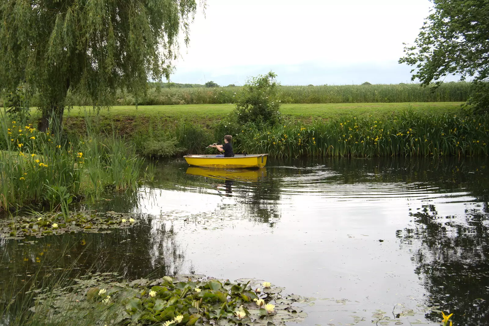 Fred floats off for a row around the pond, from Suze-fest, Braisworth, Suffolk - 19th June 2021