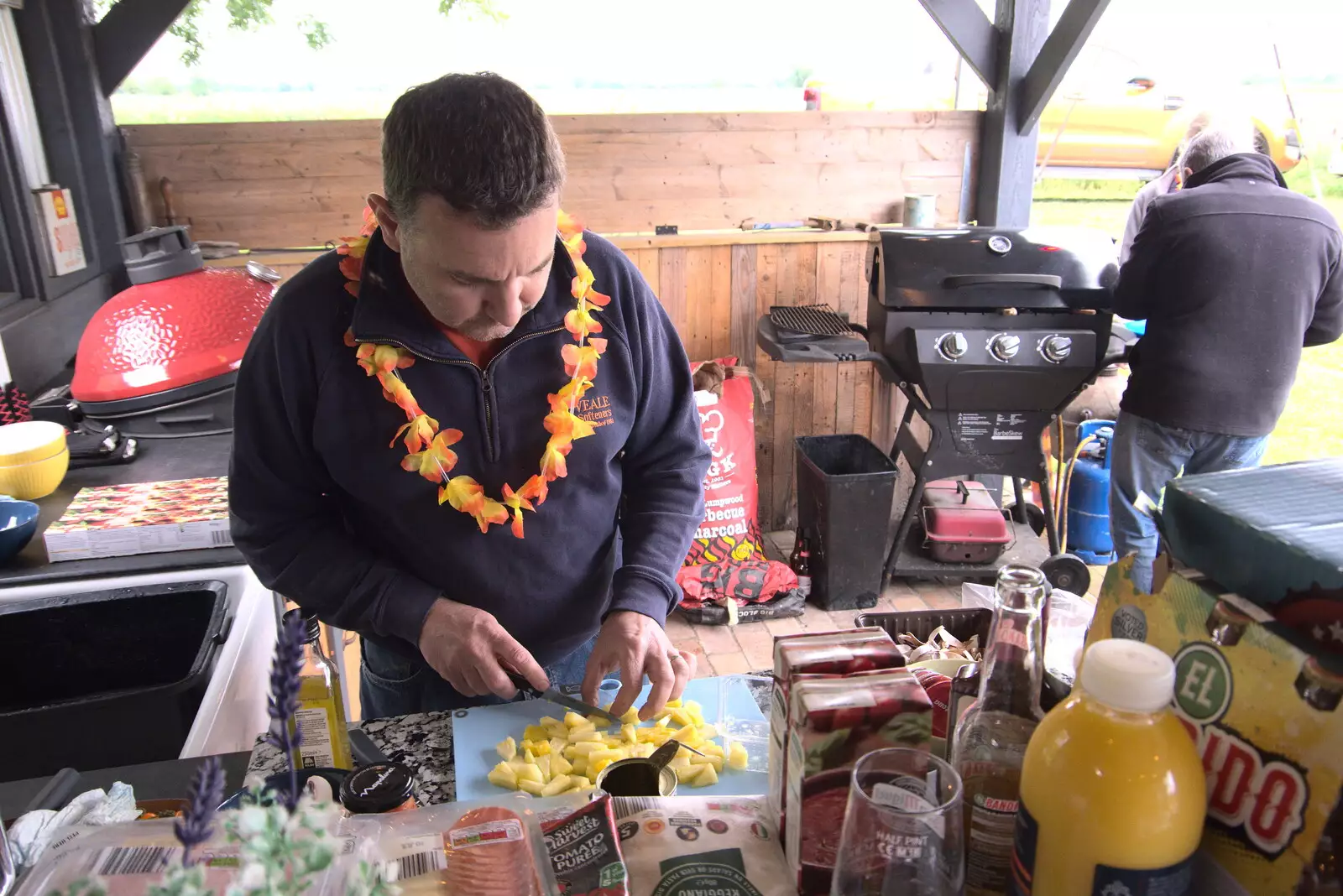 Clive chops pineapple up, from Suze-fest, Braisworth, Suffolk - 19th June 2021