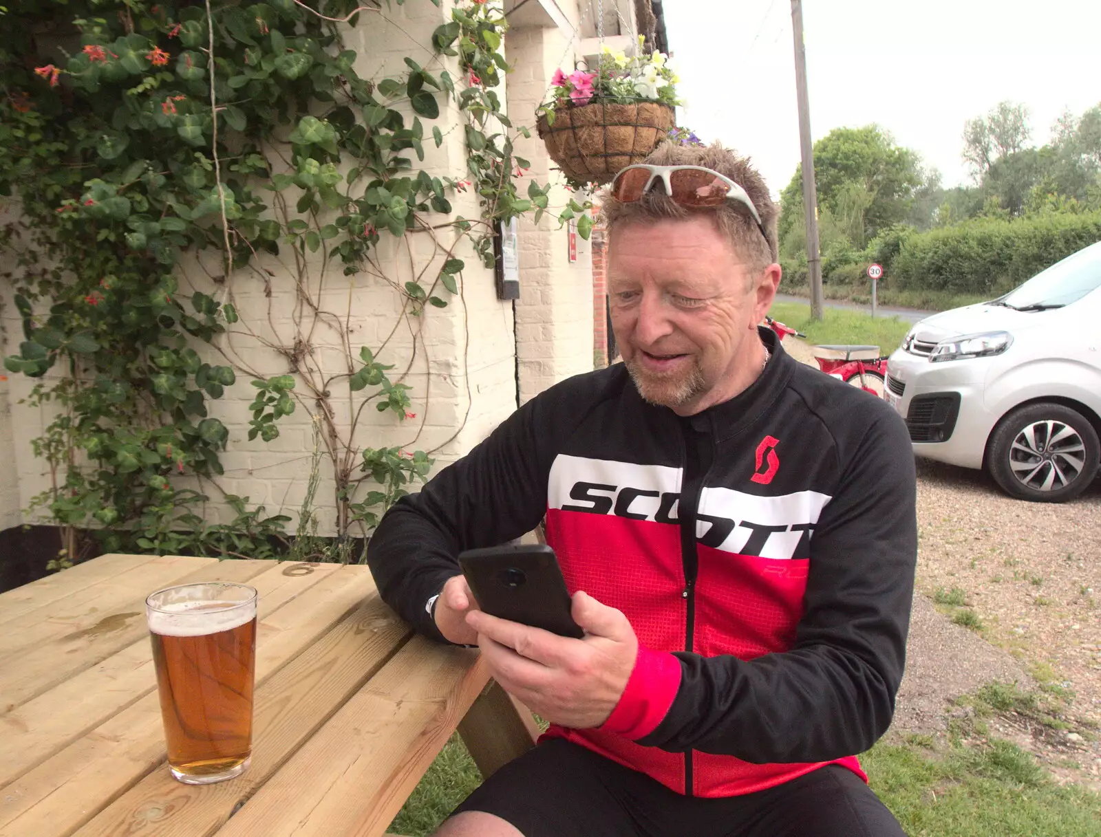 Gaz checks his phone at the Victoria, from The BSCC at Earl Soham and at Colin and Jill's, Eye, Suffolk - 26th June 2021