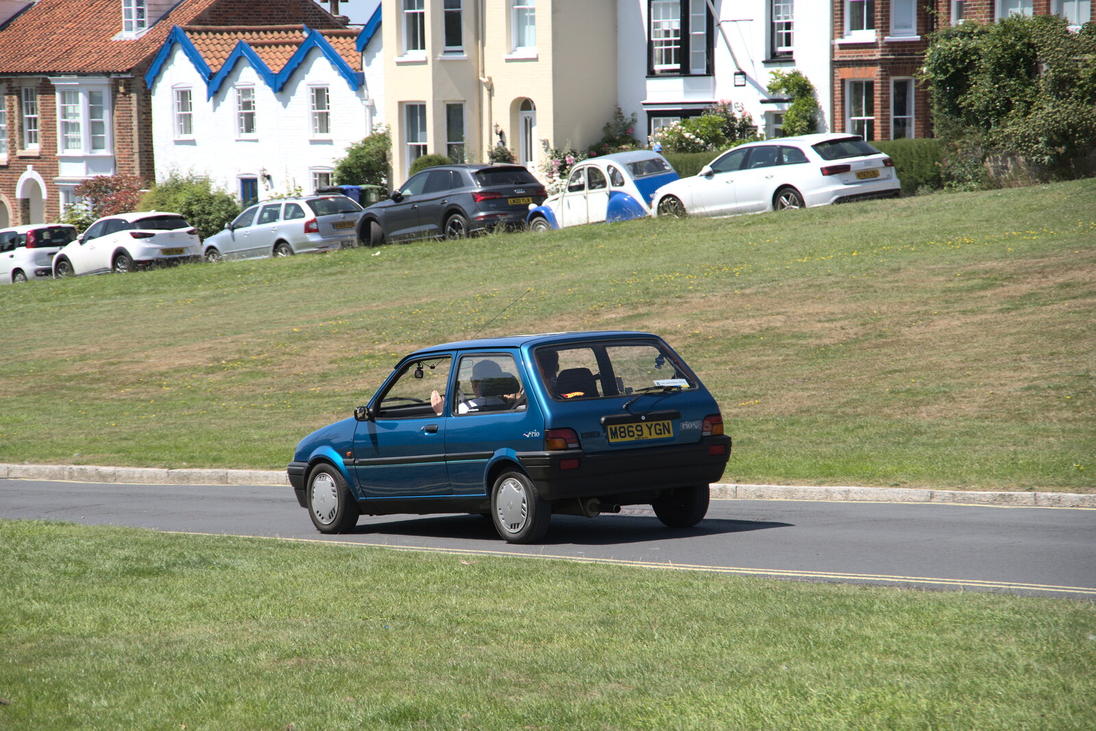 A rare mint-condition Austin Metro Rio trundles by from A Day on the Beach, Southwold, Suffolk - 18th July 2021