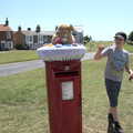 Fred points at the knitting on South Green, A Day on the Beach, Southwold, Suffolk - 18th July 2021