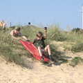 Harry gets a push down the dunes on a body board, A Day on the Beach, Southwold, Suffolk - 18th July 2021
