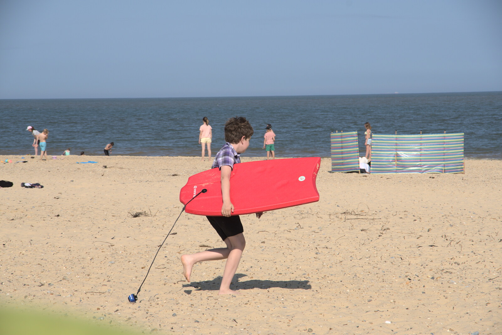 Fred hauls the body board off for a go from A Day on the Beach, Southwold, Suffolk - 18th July 2021