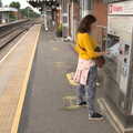 Isobel gets tickets from the machine at Diss, A Trip to Nando's, Riverside, Norwich, Norfolk - 23rd July 2021