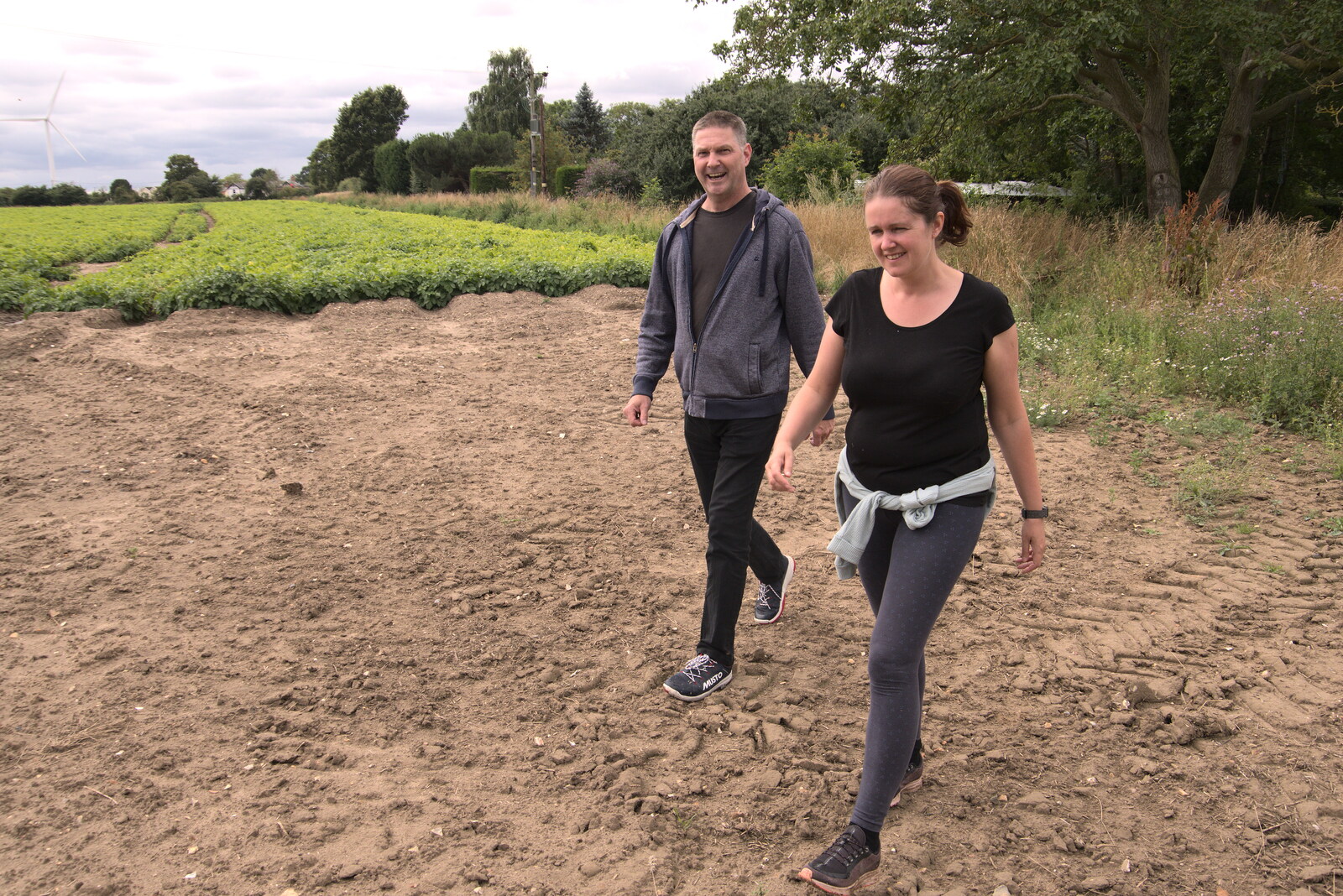 Sean and Isobel stride across the fields from Meg-fest, and Sean Visits, Bressingham and Brome, Suffolk - 1st August 2021