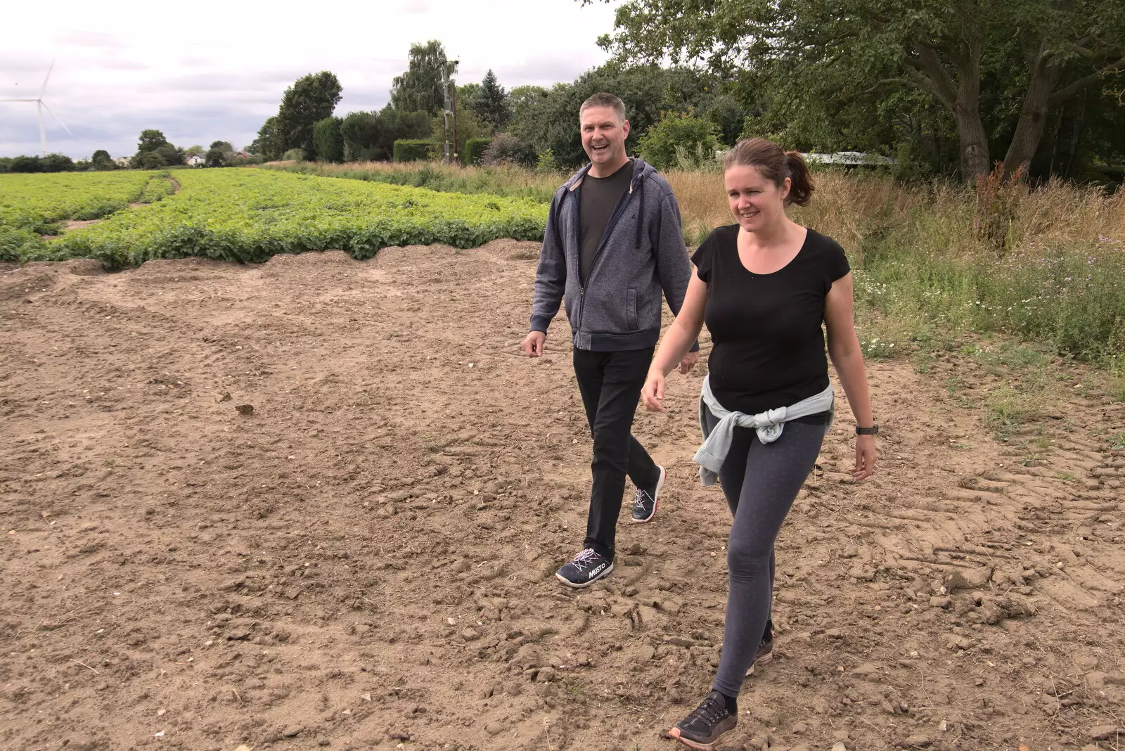 Sean and Isobel stride across the fields, from Meg-fest, and Sean Visits, Bressingham and Brome, Suffolk - 1st August 2021