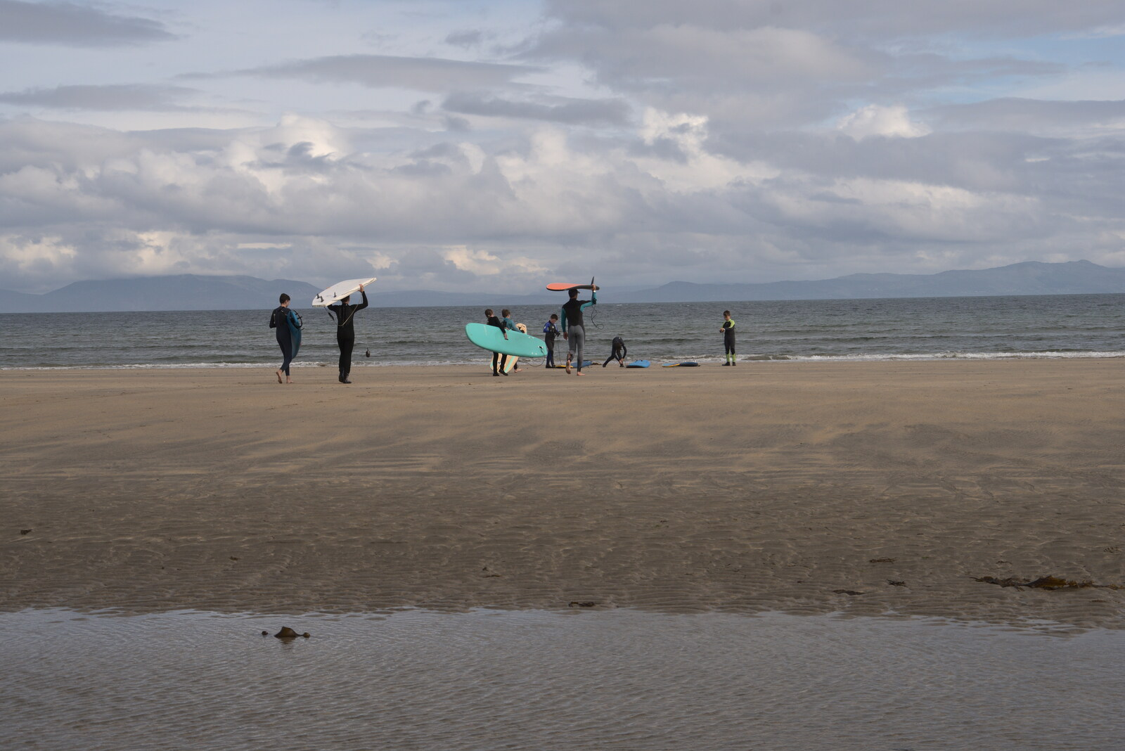 Pints of Guinness and Streedagh Beach, Grange and Sligo, Ireland - 9th August 2021: The surf school heads out to sea