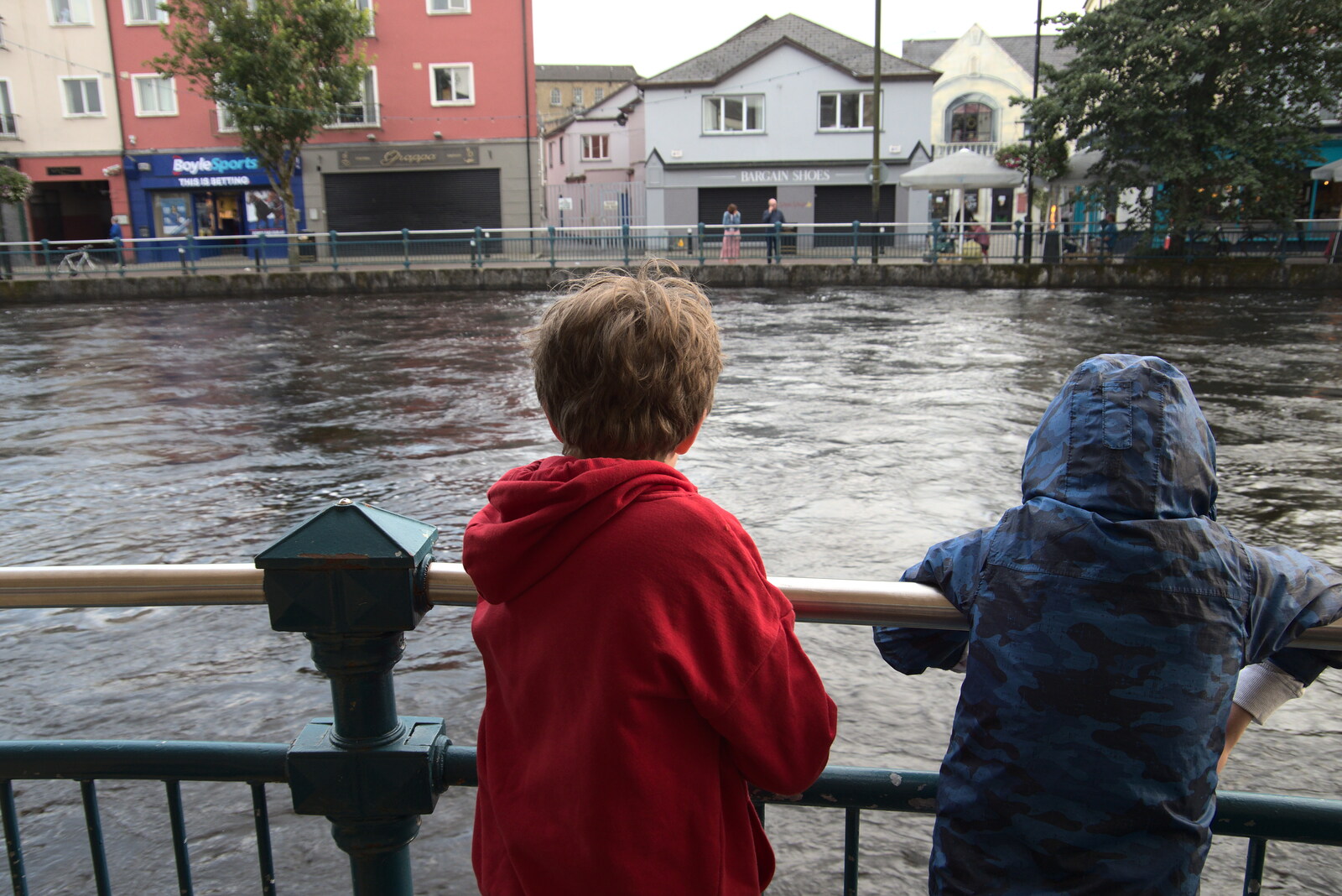 Pints of Guinness and Streedagh Beach, Grange and Sligo, Ireland - 9th August 2021: The boys look out over the almost-overflowing river